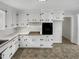 Traditional kitchen showcases white cabinets and black appliances at 623 Sybil Dr, Durham, NC 27703