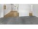 Spacious Living Room open to bright kitchen with white cabinetry at 623 Sybil Dr, Durham, NC 27703