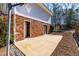 Brick patio in backyard features a basketball hoop and freshly tilled garden at 6500 Brandywine Rd, Raleigh, NC 27607