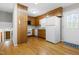 Functional kitchen with wooden cabinets, white appliances, and hardwood floors in an open layout at 6500 Brandywine Rd, Raleigh, NC 27607