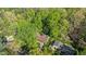 Stunning aerial view of the home nestled amongst lush greenery and mature trees, showcasing the property's landscape at 6504 Brandywine Rd, Raleigh, NC 27607