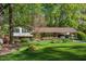 Charming home with a well-manicured front yard, lovely landscaping, and a convenient carport at 6504 Brandywine Rd, Raleigh, NC 27607