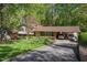 Inviting home with a well-maintained front yard, a paved driveway, and a convenient covered carport at 6504 Brandywine Rd, Raleigh, NC 27607