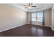 Bedroom with hardwood floors, trey ceiling, ceiling fan, and natural light at 6623 Academic Ave, Raleigh, NC 27616