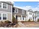 Attractive townhome featuring a covered front porch and appealing exterior color scheme at 6623 Academic Ave, Raleigh, NC 27616