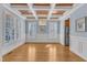 Elegant dining room with hardwood floors, coffered ceiling, and stainless steel refrigerator at 7025 Dayton Ridge Dr, Apex, NC 27539