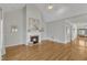 Bright living room with hardwood floors, fireplace, and open layout, perfect for entertaining at 7025 Dayton Ridge Dr, Apex, NC 27539