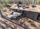 Aerial view of home with large deck and plenty of windows, nestled among trees at 748 Shady Lawn Rd, Chapel Hill, NC 27514