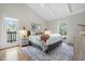 Comfortable bedroom featuring a plush bed, neutral decor, and a balcony entrance at 748 Shady Lawn Rd, Chapel Hill, NC 27514