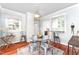 Charming dining room featuring hardwood floors, large window, and stylish decor at 816 Carolina Ave, Durham, NC 27705