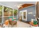 Relaxing screened-in porch with ceiling fan, seating, and a view of the yard at 816 Carolina Ave, Durham, NC 27705