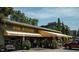 Exterior of Vin Rouge restaurant with outdoor seating and landscaping at 816 Carolina Ave, Durham, NC 27705