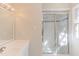 Well-lit bathroom showcases a glass-enclosed shower and vanity with ample counter space at 816 Churchill Dr, Chapel Hill, NC 27517