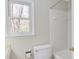 Bathroom with a view from the window and a combined tub and shower at 816 Churchill Dr, Chapel Hill, NC 27517