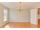 Dining room featuring hardwood floors, a chandelier, and natural light at 816 Churchill Dr, Chapel Hill, NC 27517