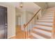 Inviting foyer with hardwood floors and a staircase with carpet at 816 Churchill Dr, Chapel Hill, NC 27517