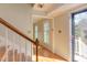 Bright foyer featuring hardwood floors and a staircase at 816 Churchill Dr, Chapel Hill, NC 27517