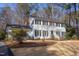 Traditional two-story home featuring black shutters and a brick chimney at 816 Churchill Dr, Chapel Hill, NC 27517
