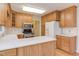 Kitchen with wood cabinets, stainless steel appliances, and breakfast bar at 816 Churchill Dr, Chapel Hill, NC 27517