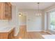 Eat-in kitchen with hardwood floors, a chandelier, and lots of counter space at 816 Churchill Dr, Chapel Hill, NC 27517
