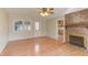 Living room with brick fireplace, hardwood floors, and natural light at 816 Churchill Dr, Chapel Hill, NC 27517