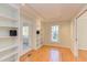 Inviting living room featuring hardwood floors, built-in shelves, and ample natural light at 816 Churchill Dr, Chapel Hill, NC 27517