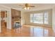 Bright living room featuring hardwood floors and a brick fireplace at 816 Churchill Dr, Chapel Hill, NC 27517