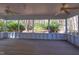 Large screened porch with wood floor and a view into the backyard at 816 Churchill Dr, Chapel Hill, NC 27517