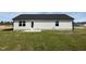 Backyard view of the home with a concrete patio and grass at 90 Pate Landing Dr, Selma, NC 27576