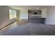 Modern kitchen offers ample counter space, grey cabinets, stainless appliances and natural light from large window at 90 Pate Landing Dr, Selma, NC 27576
