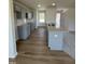 The kitchen showcases gray cabinetry, white subway tile backsplash, granite countertops, and stainless steel appliances at 90 Pate Landing Dr, Selma, NC 27576