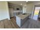 Kitchen features gray cabinets, granite countertops, stainless steel appliances and breakfast bar, perfect for entertaining at 90 Pate Landing Dr, Selma, NC 27576