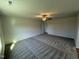 Spacious carpeted bedroom with ceiling fan and ample natural light at 90 Pate Landing Dr, Selma, NC 27576