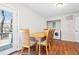 Charming dining area with hardwood floors, table with seating, and laundry unit at 9013 Langwood Dr, Raleigh, NC 27617