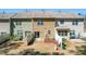 A bird's eye view of individual fenced backyard spaces of the townhomes featuring patios and sliding glass door access at 107 Vickery Hill Ct, Durham, NC 27703
