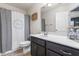 Neutral bathroom features a toilet and sink, complete with a shower boasting a decorative curtain at 107 Vickery Hill Ct, Durham, NC 27703