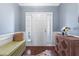 Welcoming foyer featuring a white front door with sidelights, wood floors, and decorative accents at 107 Vickery Hill Ct, Durham, NC 27703