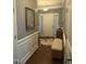 Foyer showcasing wood floors, gray walls, white trim, and a view of the front door at 107 Vickery Hill Ct, Durham, NC 27703