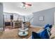 Bright, open living area featuring a breakfast bar, comfortable seating, and neutral carpet at 107 Vickery Hill Ct, Durham, NC 27703