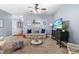 Cozy living room with neutral tones, comfortable seating, and a ceiling fan for added comfort at 107 Vickery Hill Ct, Durham, NC 27703