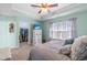 Spacious bedroom features a tray ceiling, walk-in closet, and a large window with natural light at 107 Vickery Hill Ct, Durham, NC 27703