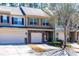 Attractive townhomes featuring stone accents and well-maintained landscaping in a quiet neighborhood at 107 Vickery Hill Ct, Durham, NC 27703