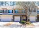 Attractive townhomes featuring stone accents and well-maintained landscaping in a quiet neighborhood at 107 Vickery Hill Ct, Durham, NC 27703
