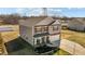 A two-story home with a well-manicured lawn, stone accents, and a two-car garage at 110 Lodgepole Ln, Burlington, NC 27215
