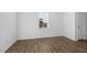 Light-filled bedroom with decorative molding, a window and hardwood floors at 110 Lodgepole Ln, Burlington, NC 27215
