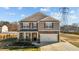 Charming two-story home with a two-car garage and stone accents at 110 Lodgepole Ln, Burlington, NC 27215