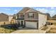 A stylish home with a two-car garage, stone accents and a well-kept lawn at 110 Lodgepole Ln, Burlington, NC 27215