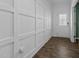Hallway with wainscoting detail and wood-look floors at 110 Lodgepole Ln, Burlington, NC 27215