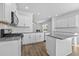 Bright kitchen boasts white cabinets, granite countertops and subway tile backsplash at 110 Lodgepole Ln, Burlington, NC 27215