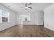 Bright living room features hardwood floors with a view of the kitchen at 110 Lodgepole Ln, Burlington, NC 27215